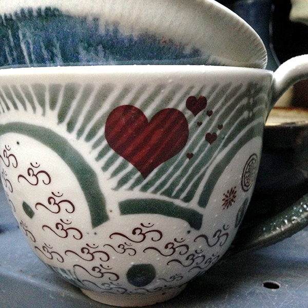 Stripes shining through the decal heart on Carol Whitney's mug